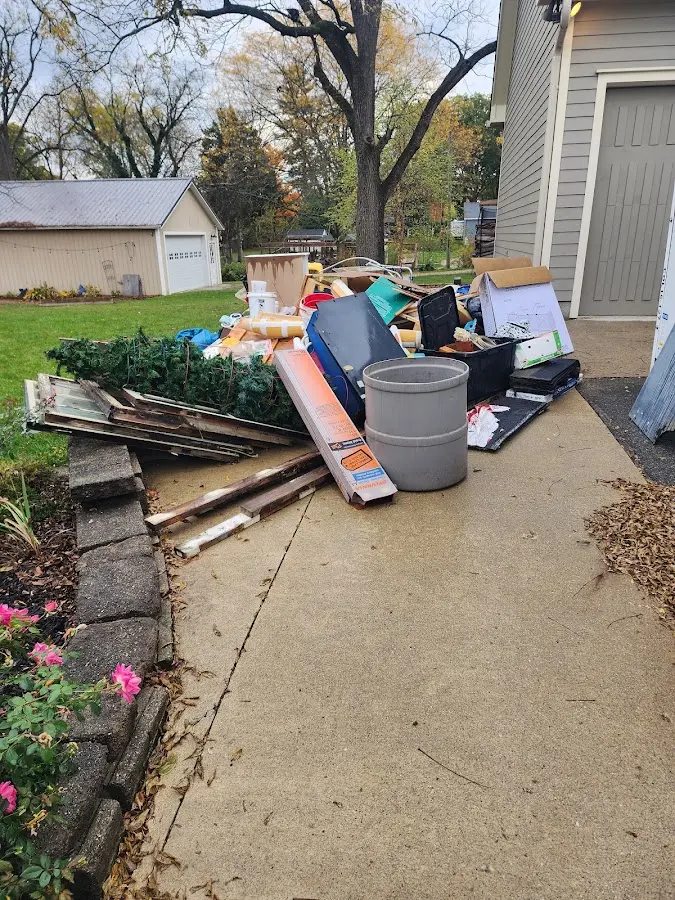 Dumpster being loaded with debris for 3 Yard Dumpster Rental in Glen Rock